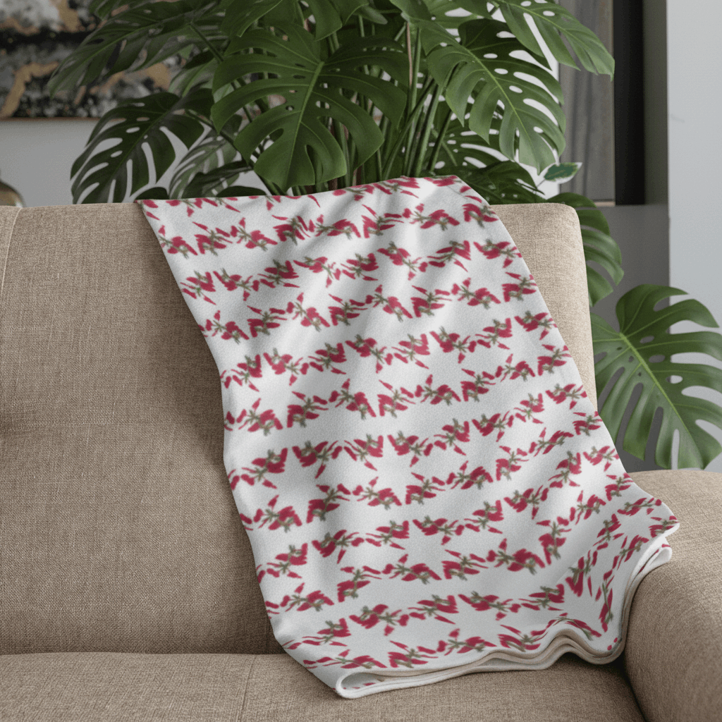 Plaid blanc motifs étoiles rouge sur canapé gris