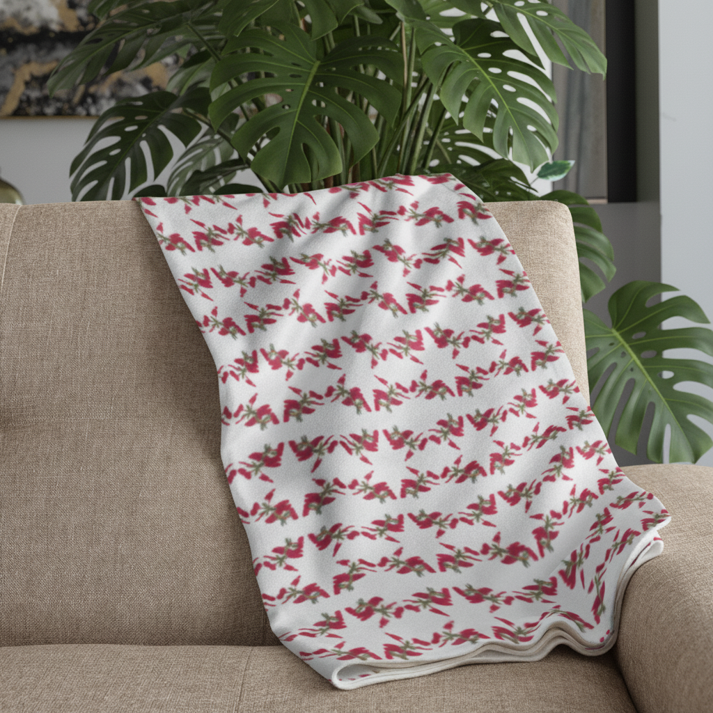 Plaid blanc motifs étoiles rouge sur canapé gris