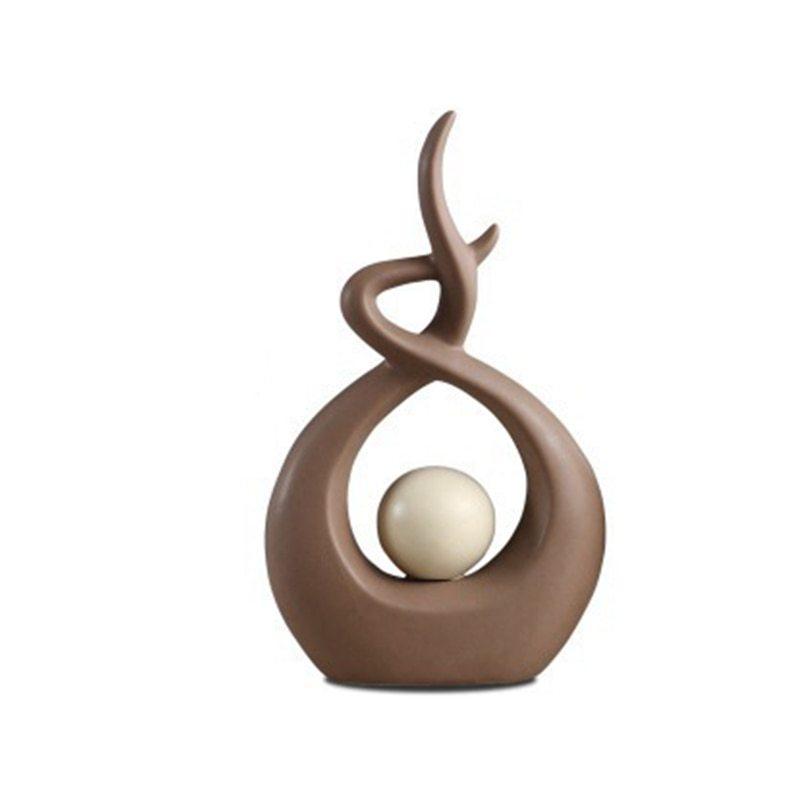 Sculpture forme abstraite marron boule blanche