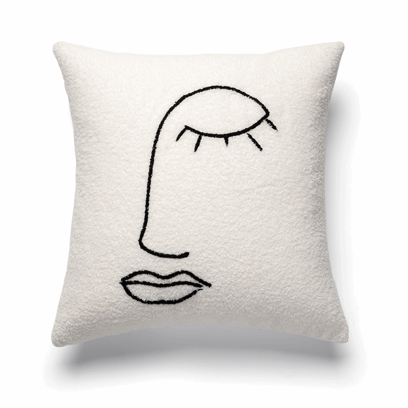 Coussin duvet blanc forme visage artistique